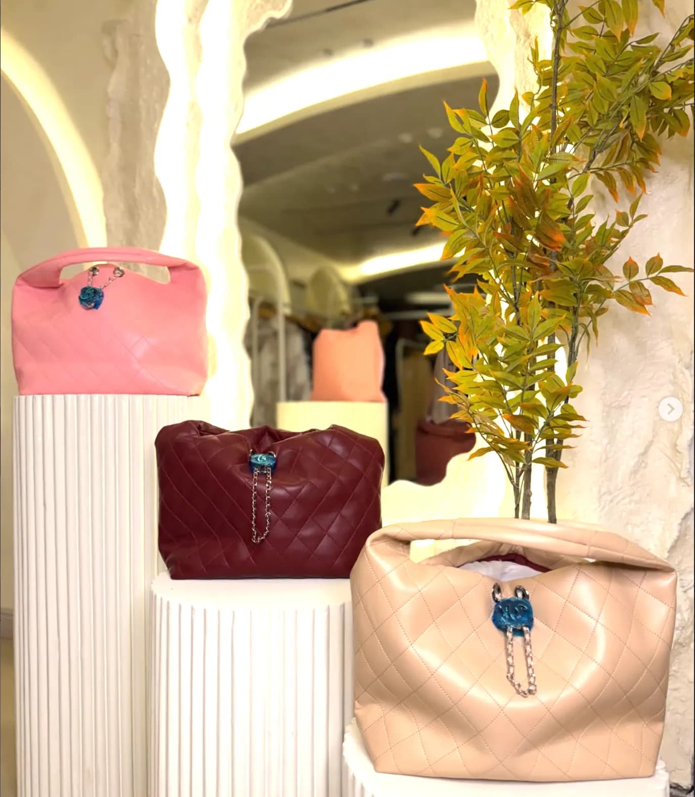 Quilted hobo bags in pink, oxblood and beige