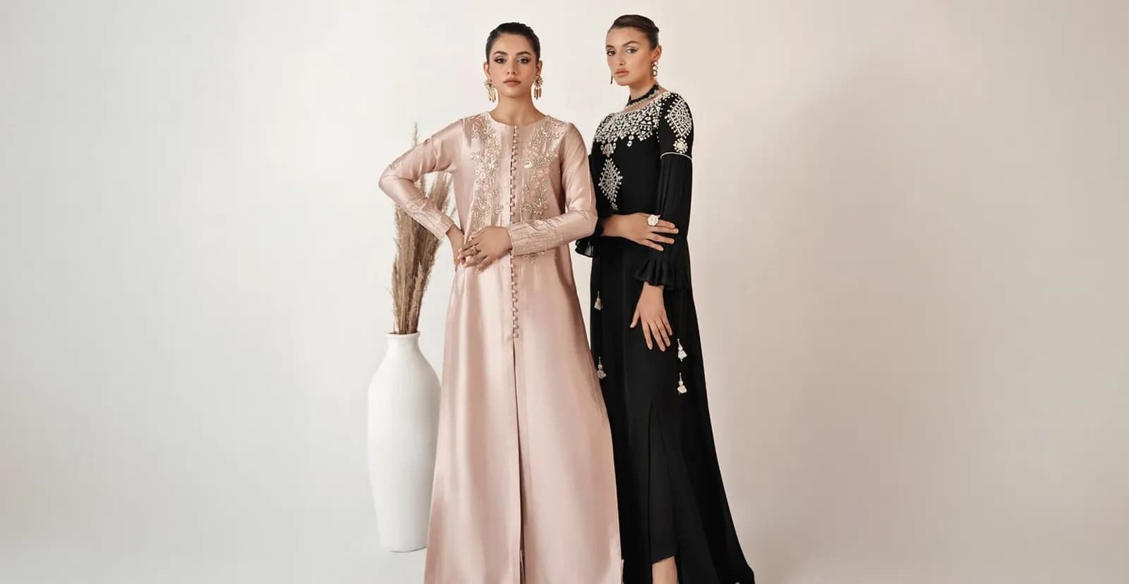 Two models in embroidered silk kaftans