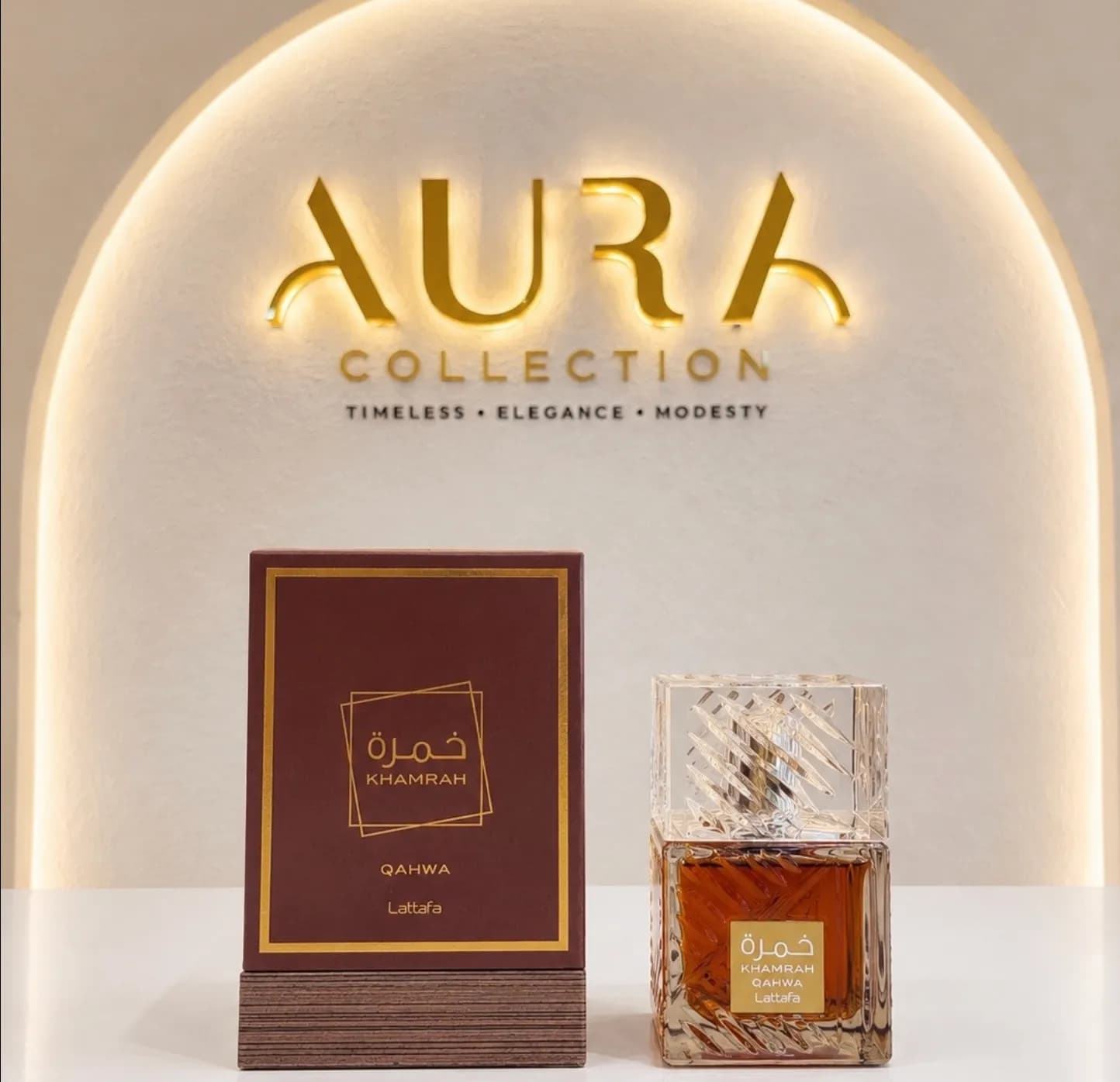 Amber perfume bottle on wooden riser